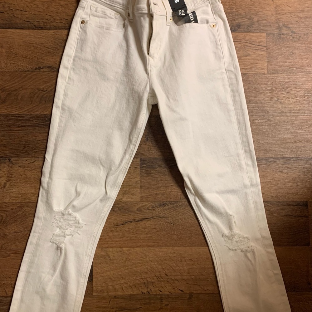 All white ripped Express jeans